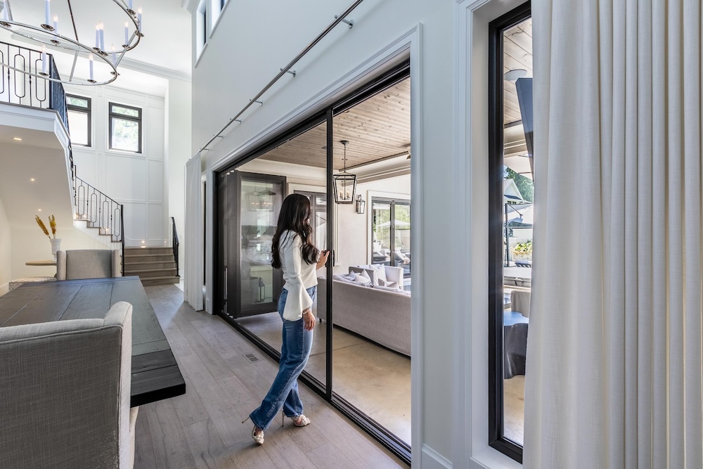woman standing by patio sliding doors